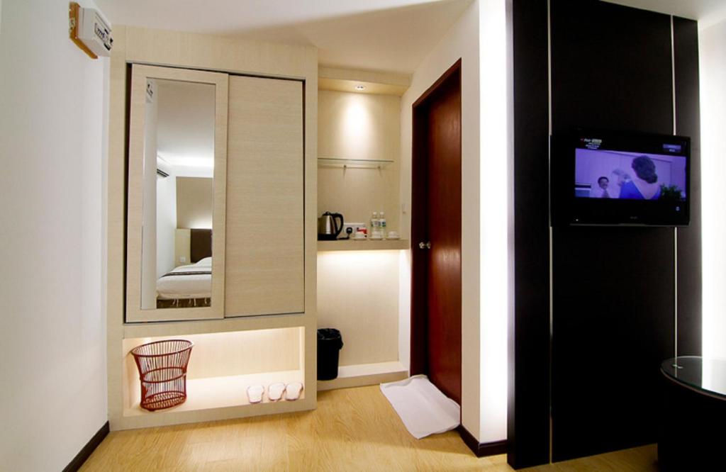TV a/nebo společenská místnost v ubytování Kingsley Hotel