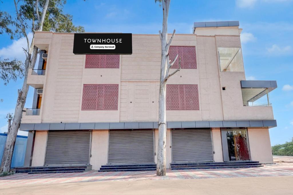 a building with a sign that reads townhouse at Townhouse Roorkee Bypass in Roorkee
