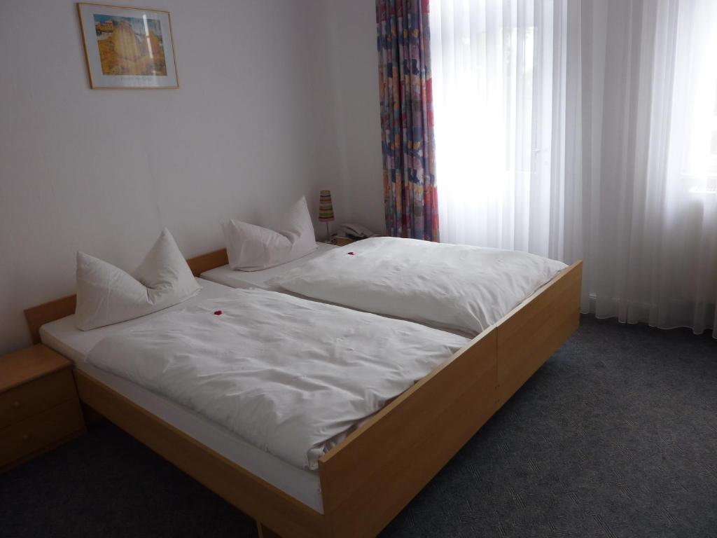 Postel nebo postele na pokoji v ubytování Hotel Oranien