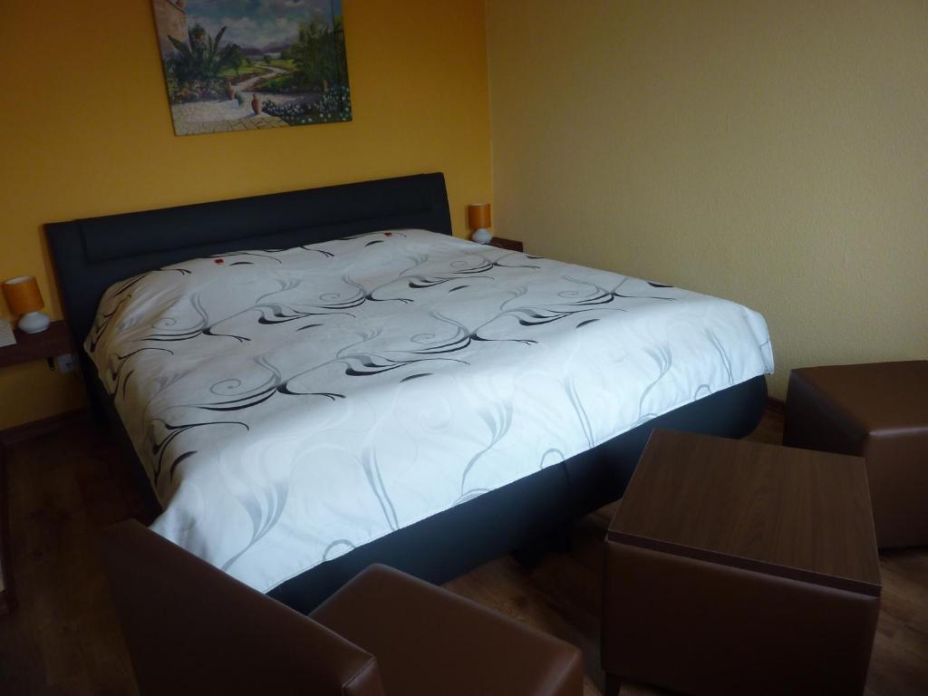 Postel nebo postele na pokoji v ubytování Hotel Oranien