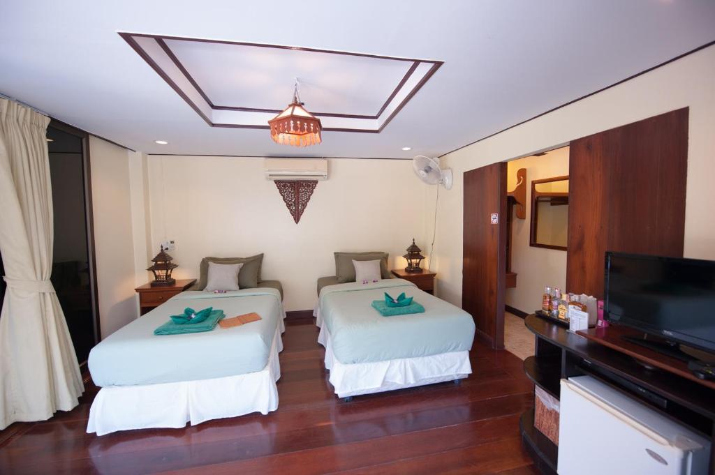 Postel nebo postele na pokoji v ubytování Koh Kood Beach Resort