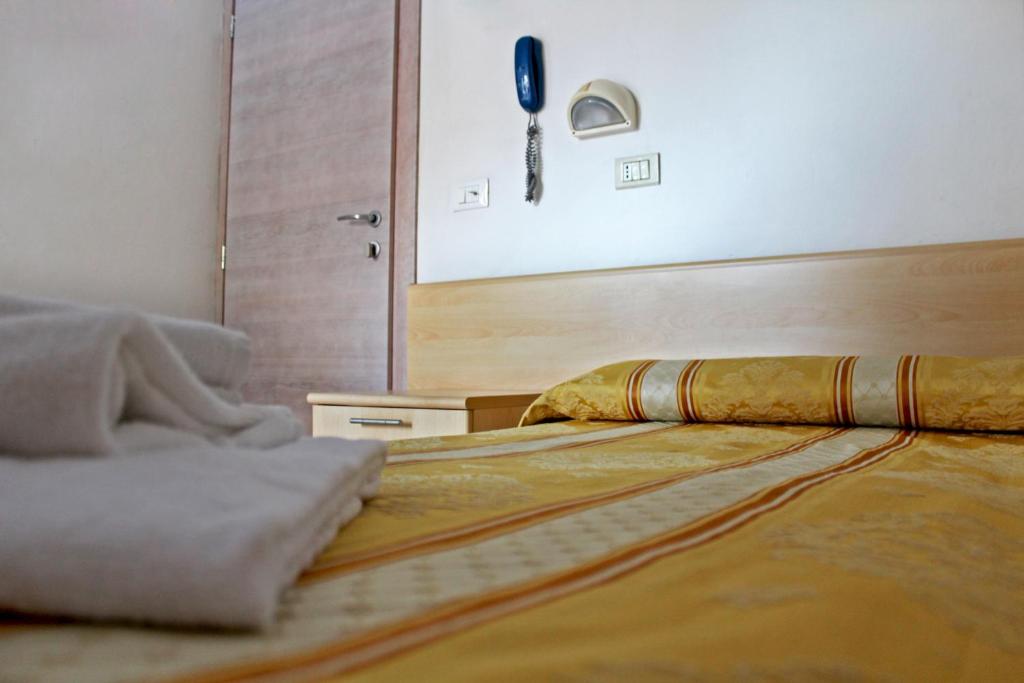 Łóżko lub łóżka w pokoju w obiekcie Hotel New Primula