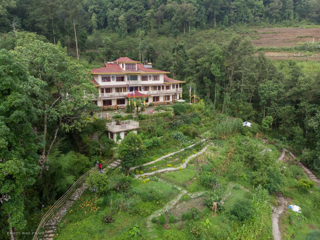 a large house on top of a hill at Bamboo Retreat Hotel in Gangtok
