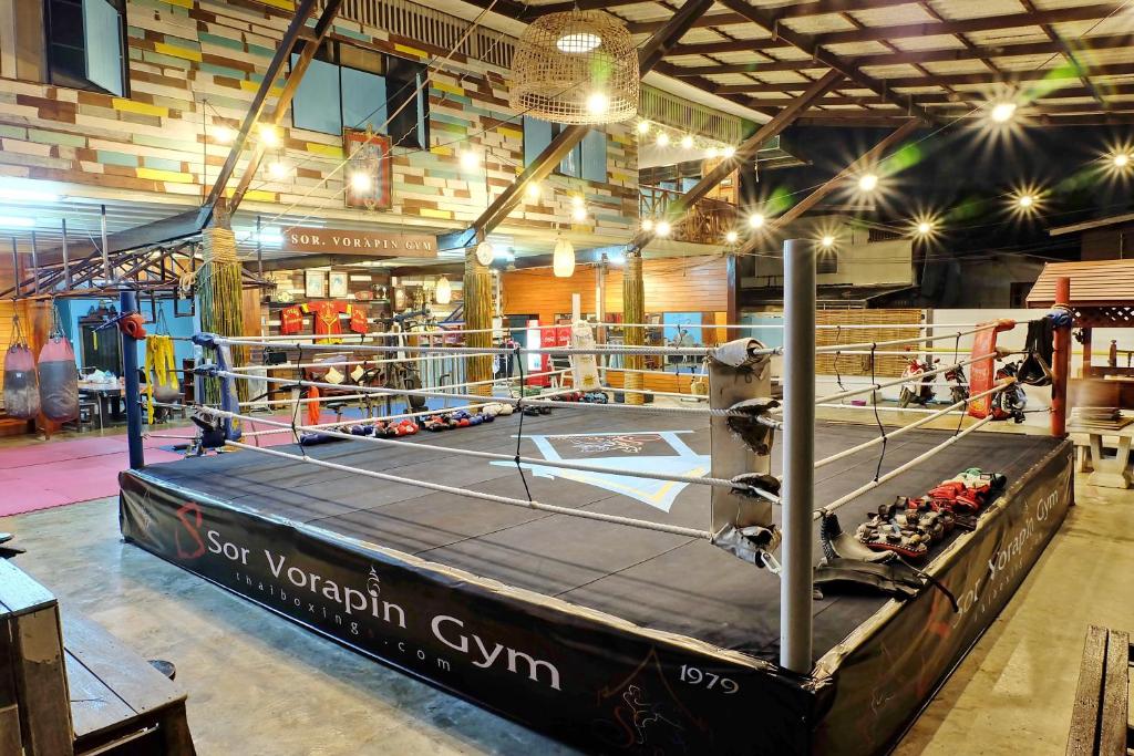 a boxing ring in a gym with a wrestling at Sor Vorapin Muay Thai Home in Bangkok