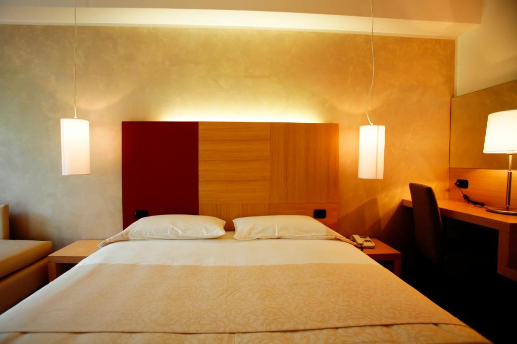 Postel nebo postele na pokoji v ubytování Cascina Scova Resort