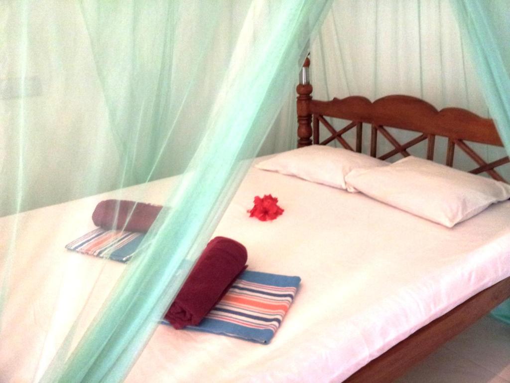 Postel nebo postele na pokoji v ubytování Rainbow Guest House