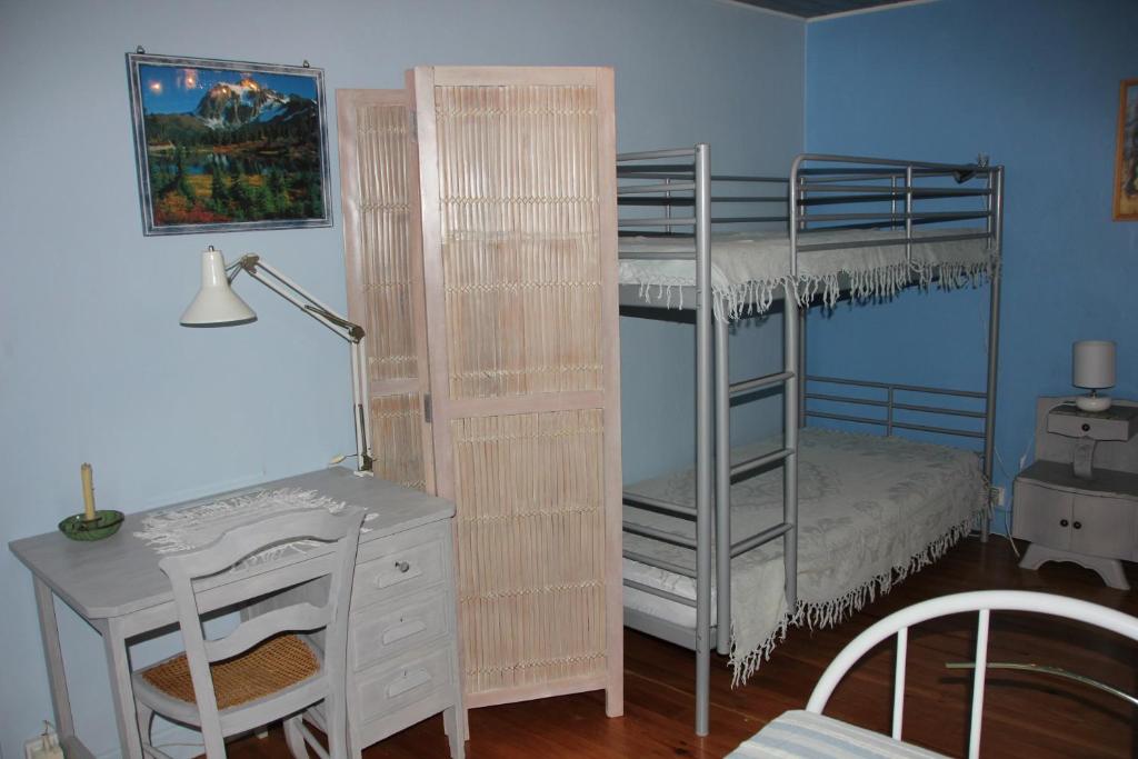 Postel nebo postele na pokoji v ubytování Le Moulin
