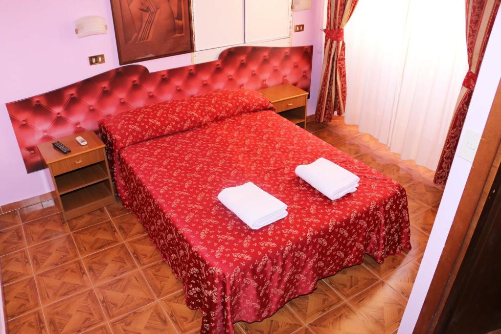 Postel nebo postele na pokoji v ubytování Hotel Gabriele