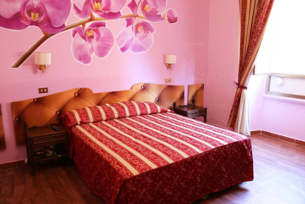 Postel nebo postele na pokoji v ubytování Hotel Gabriele