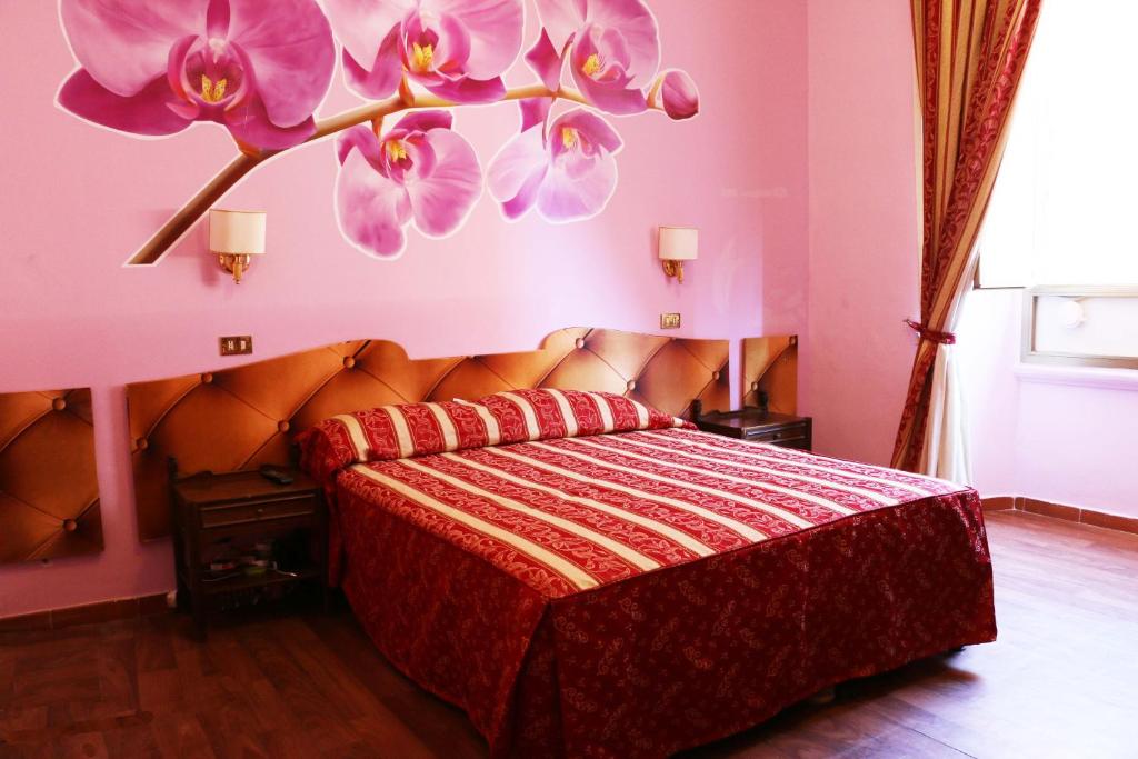Postel nebo postele na pokoji v ubytování Hotel Gabriele