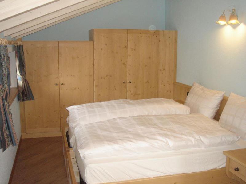 Postel nebo postele na pokoji v ubytování Armonia Livigno Appartamenti