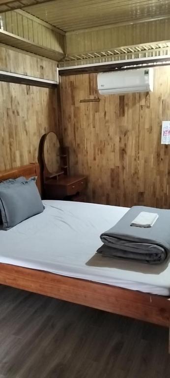 a bed in a room with a mattress at Ngoặng homestay - phòng nghỉ trọ in Chiêm Hóa
