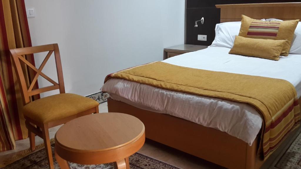 Postel nebo postele na pokoji v ubytování Hotel Julius