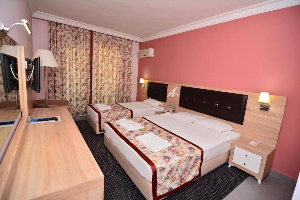 Postel nebo postele na pokoji v ubytování Ananas Hotel