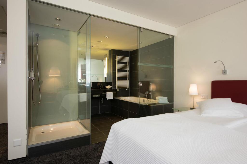 Postel nebo postele na pokoji v ubytování Hotel Glockenhof Zürich