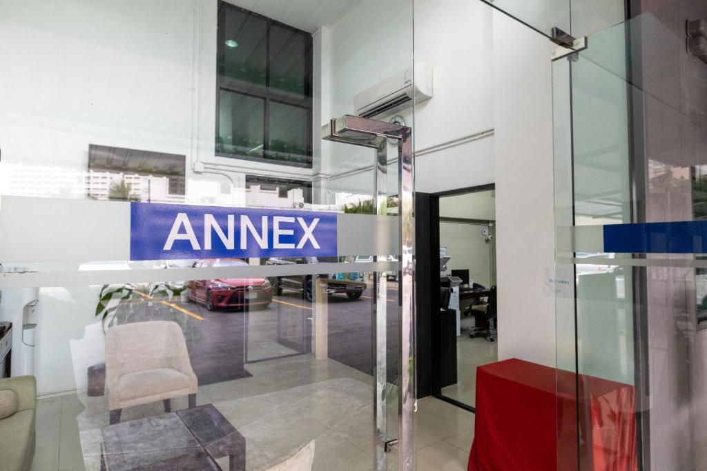 an entrance to an msg sign in a building at Annex Lumpini Bangkok in Bangkok
