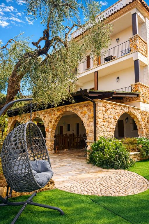 a chair in a yard in front of a building at La Chianconata- Casa vacanze a Vieste in Vieste