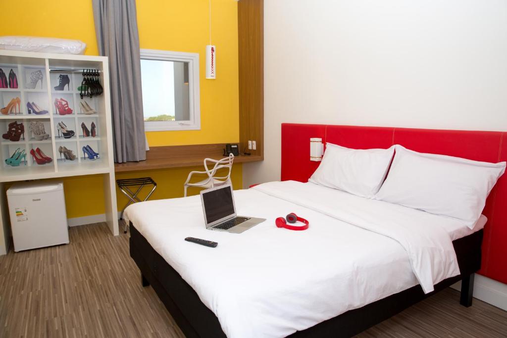 Postel nebo postele na pokoji v ubytování ibis Styles Birigui