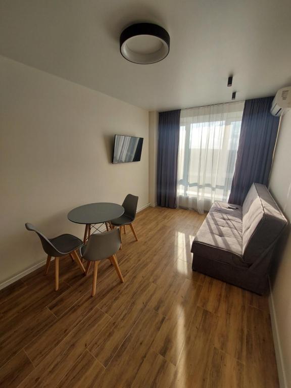 a living room with a table and a couch at Apartment in Irpin Pavlenka in Irpin