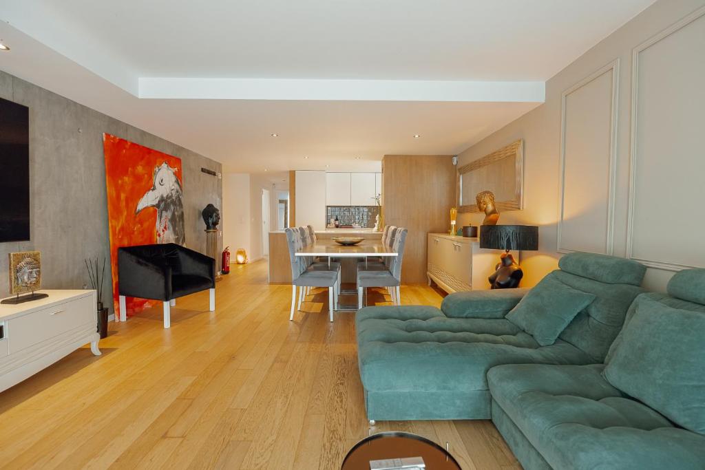 a living room with a couch and a table at Luxury Beach House by Hosty in Canidelo
