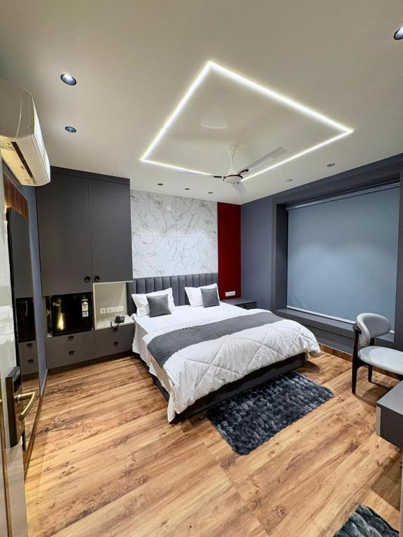 a bedroom with a large bed in a room at Hotel Starway in Hisār
