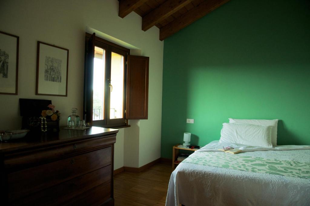 Postel nebo postele na pokoji v ubytování Cascina delle Mele