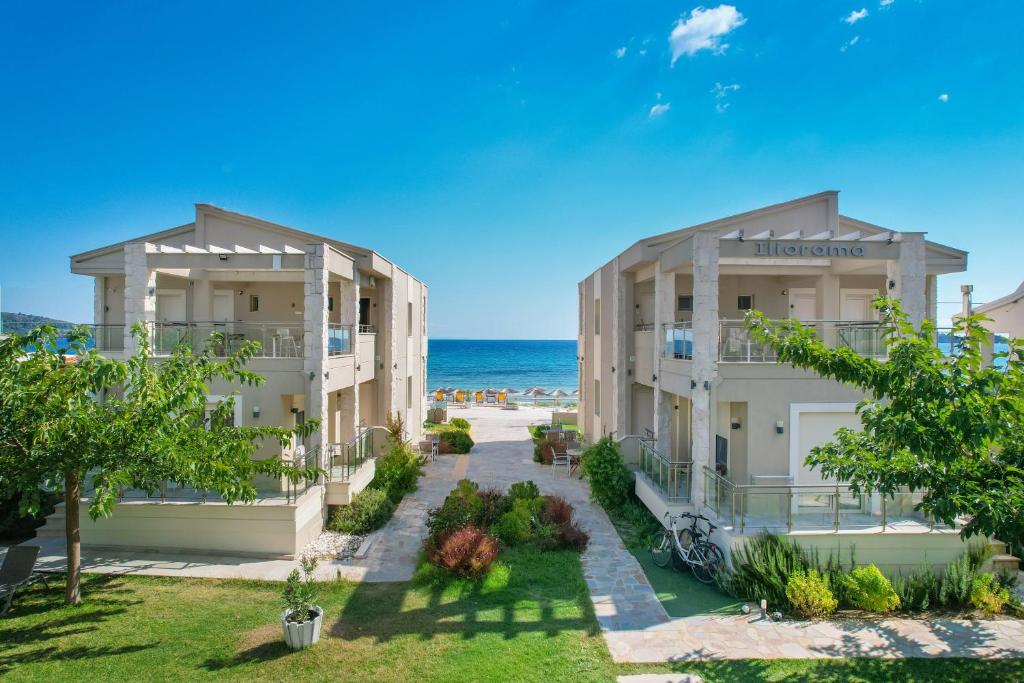 a view of the ocean from the balcony of a hotel at Iliorama Luxury Apartments in Skala Potamias