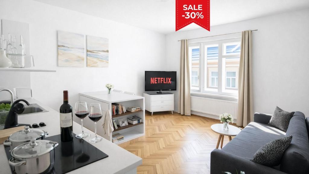 a living room with a couch and a tv at Mona Lisa Apartment in Bratislava