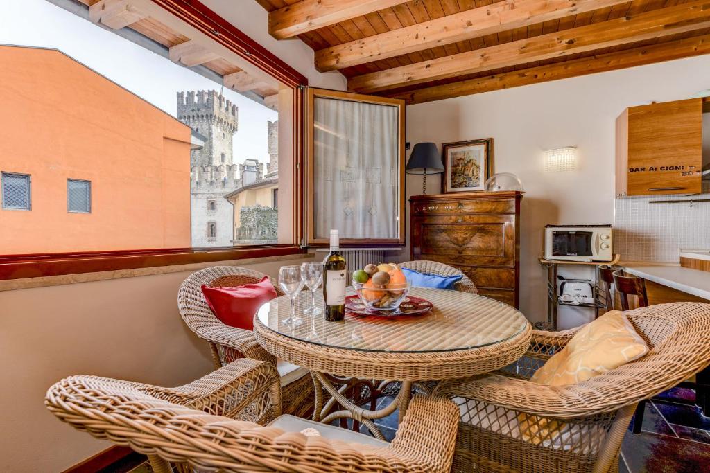 a dining room with a table and chairs at Luxury Castle View in Sirmione