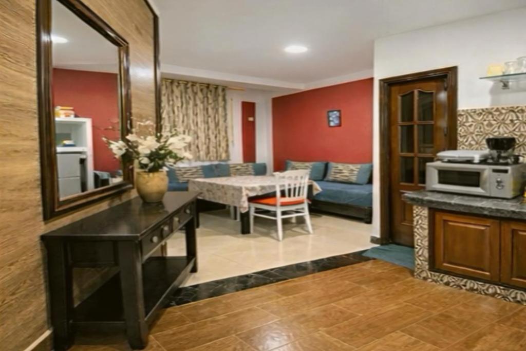 a living room with a couch and a table at Coin de repôs in Oujda
