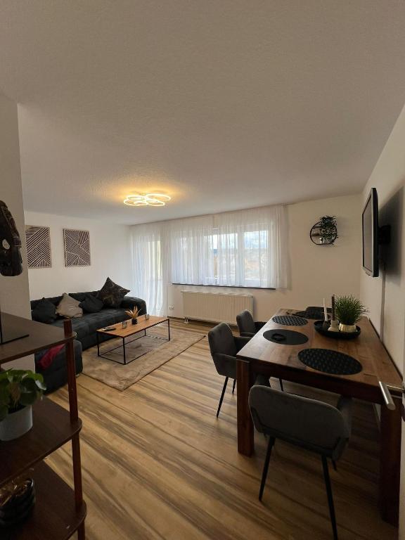 a living room with a couch and a table at Schwarzwald Loft in Villingen-Schwenningen