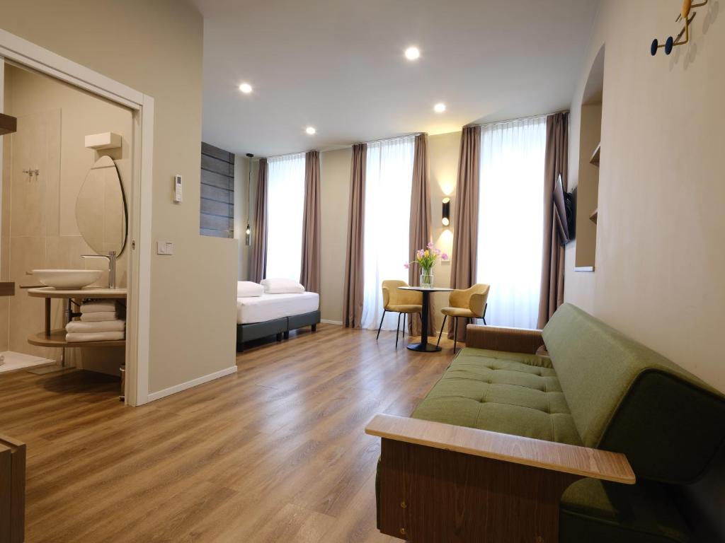 a living room with a couch and a table at SOUL OF TRENTO San Martino in Trento