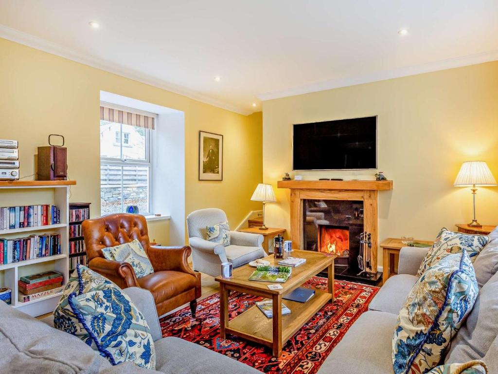 a living room with a couch and a fireplace at 3 Bed in Inverness oc-ca134 in Farr