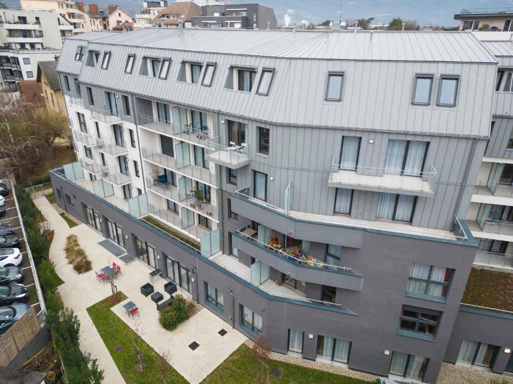an aerial view of a building with a balcony at Appart One Chambéry in Chambéry