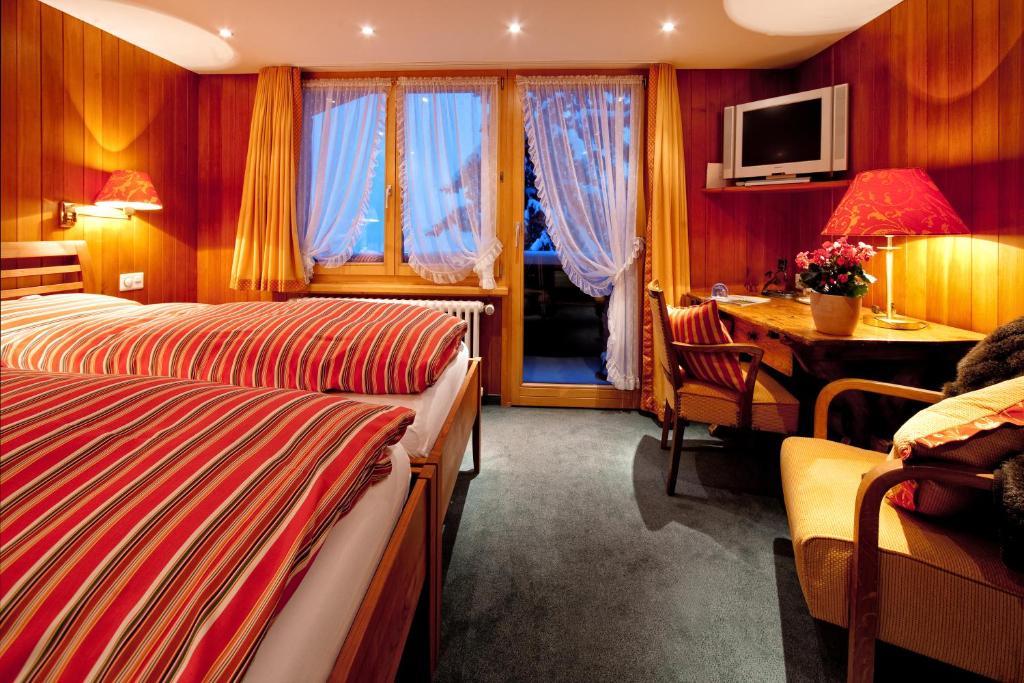 Postel nebo postele na pokoji v ubytování Hotel Arlenwald