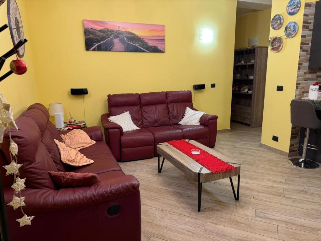 a living room with a couch and a coffee table at Sabry house in Novi Ligure