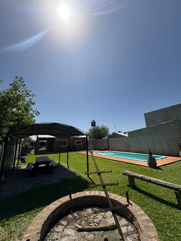 a backyard with a fire pit and a pool at El Colibrí 1 in Arroyo Seco