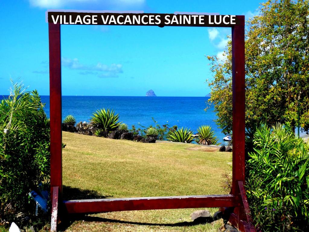 a sign that reads village vazquezannis santee lodge at Village vacances Saint LUCE Studio MARGARITA 35 in Sainte-Luce