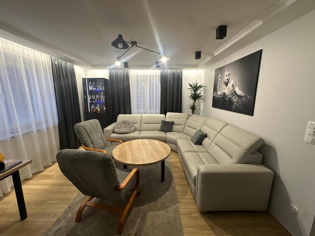 a living room with a couch and a table at Apartament rodzinny in Łańcut