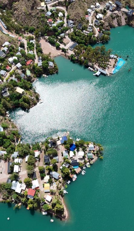 an aerial view of a group of houses in the water at Casa Las Lavandas - LOS REYUNOS in San Rafael