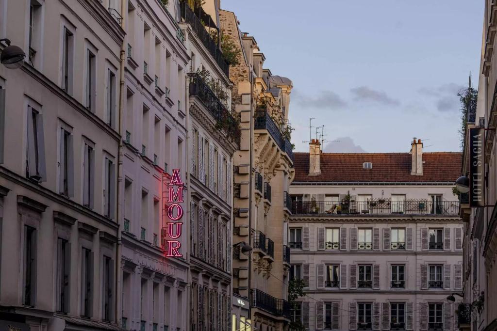 a group of buildings on a city street at Hôtel Amour Paris in Paris