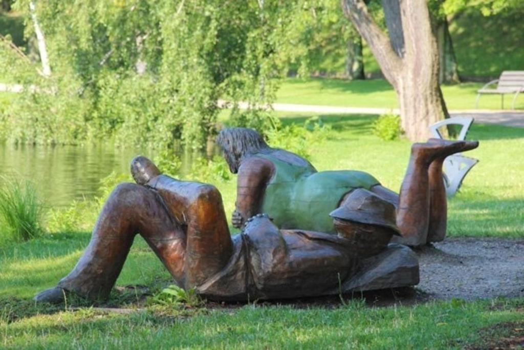 a statue of a man laying on the ground at Am Wiesenblick 2 Pers in Röbel