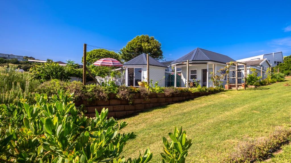a row of houses in a yard at Traka Cottages in Sedgefield