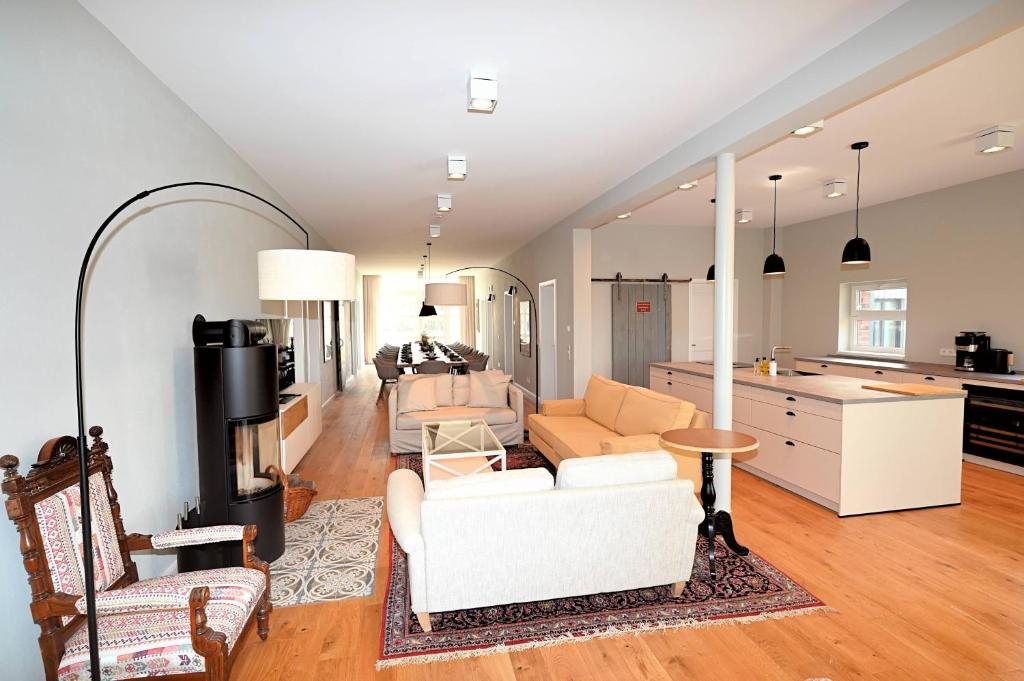 a living room with a couch and a table at Residenz R1 App 5 in Behrensdorf