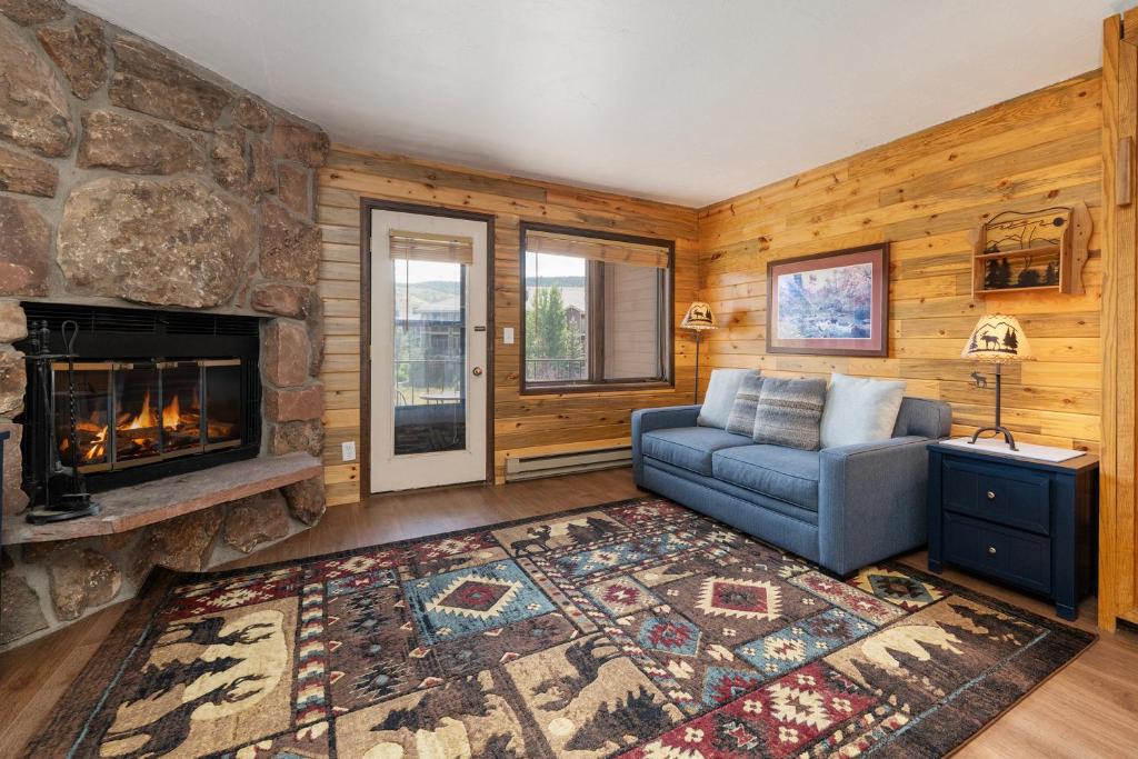 a living room with a couch and a fireplace at 564 Silvercreek Inn in Granby