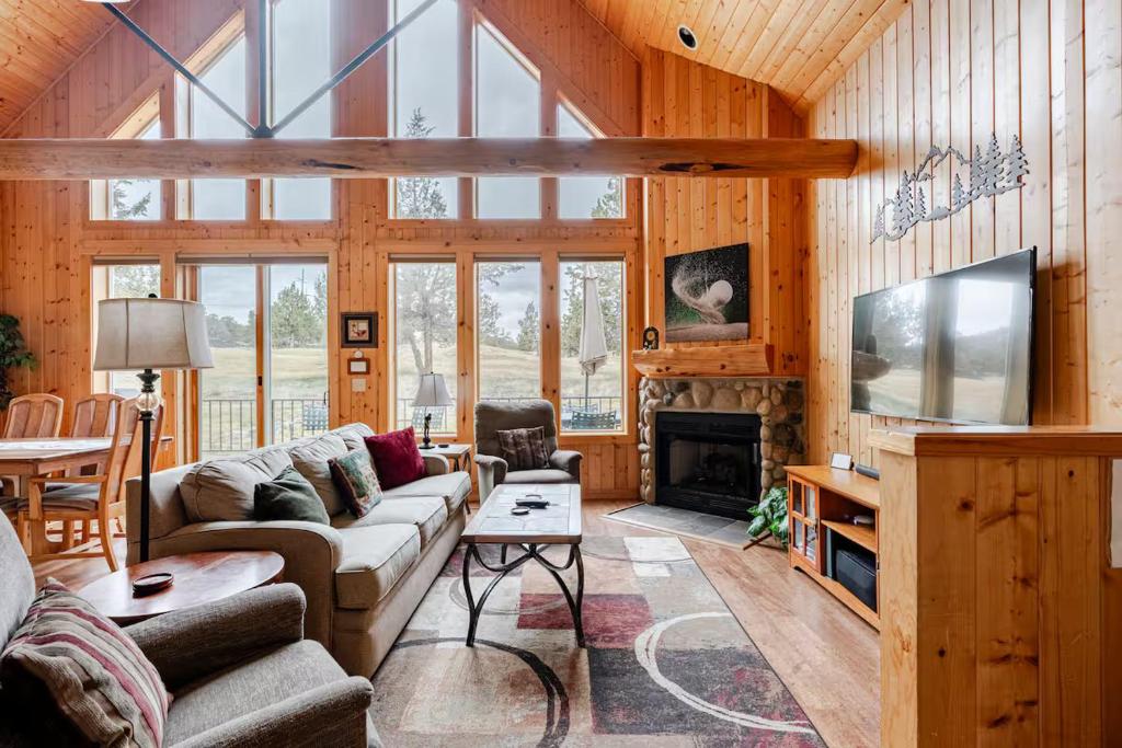 a living room with a couch and a fireplace at 19th Hole Chalet at Eagle Crest in Redmond