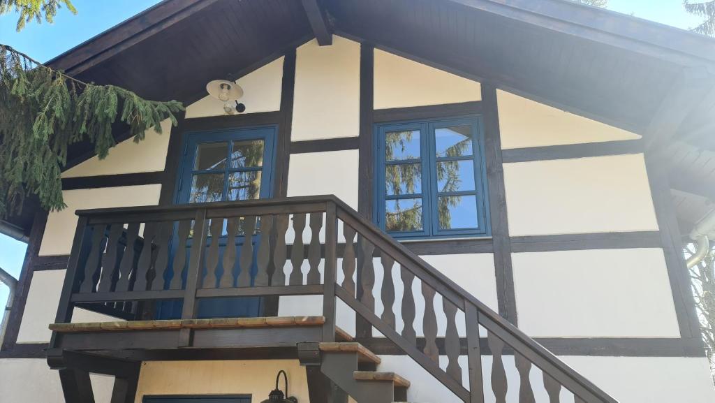 a house with a staircase and windows on it at Ferienwohnung Lottchen in Schwerin