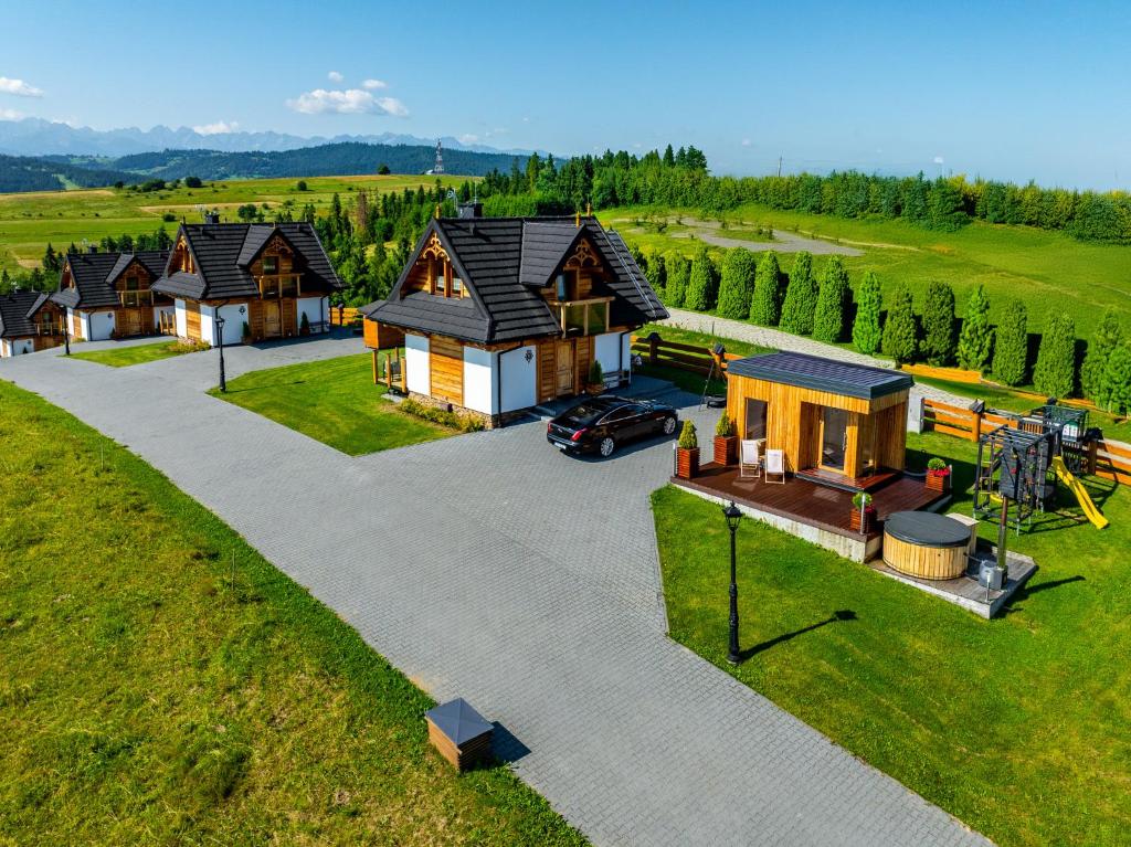 an aerial view of a house with a playground at Osada Dursztyn- Przystanek Podhale in Białka Tatrzańska