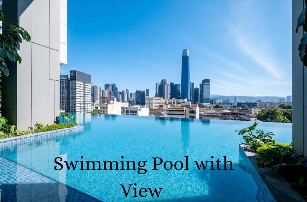 a swimming pool with a view of the city at Skyline Luxury Suite KlCC &TRX View in Kuala Lumpur