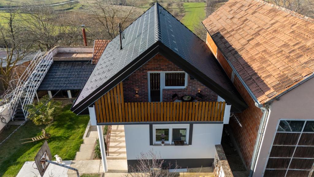 an overhead view of a house with a metal roof at Kuća za odmor Kiljer - priroda, pogled i slavonski ugođaj in Grgurevići